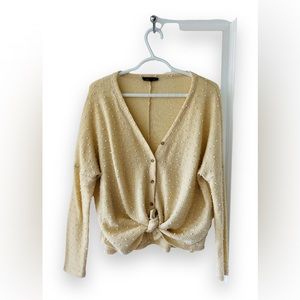 Rachael, size medium cream colored with white polka dots, button up